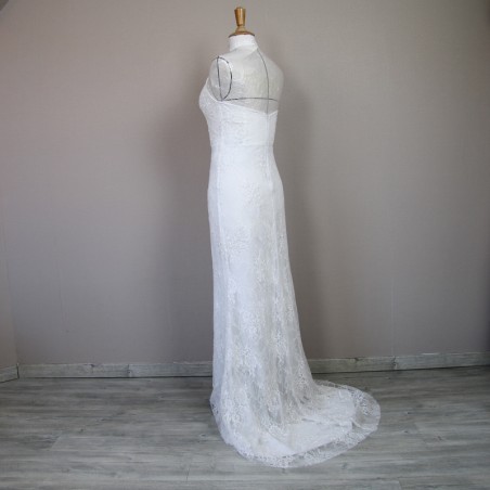 Back view of a halter neck wedding dress with elegant train and subtle lace detailing.