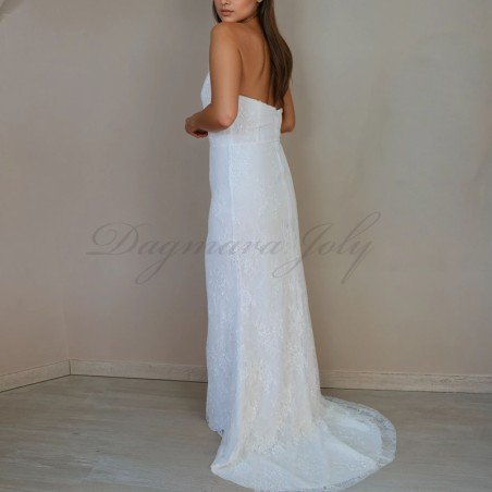 Back view of a modest halter neck lace wedding gown, capturing the dress’s backless details