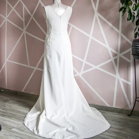 Back view showing elegant train of minimalist bridal gown