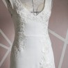 Close-up of hand embellishments on minimalist crepe bridal gown