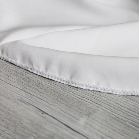 Close-up of hand embellishments on ourlet of minimalist floor length crepe bridal gown