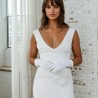 Modern bridal gown handmade in France with short train, front slit and v neckline