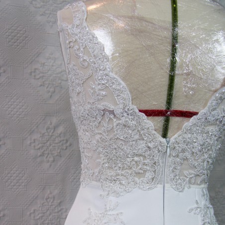Detailed view of wedding dress train with lace and crystal appliqué