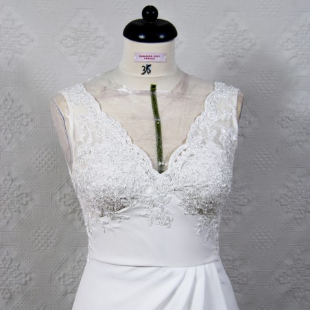 Luxury beaded lace wedding gown on dummy – plunging neckline and thigh slit