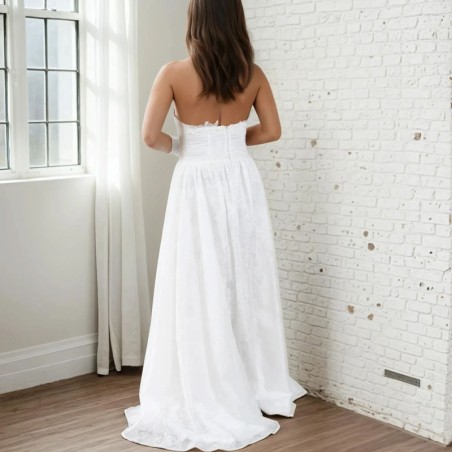 Back view of a handmade wedding gown with open halter back, lace detailing