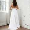 Back view of a handmade wedding gown with open halter back, lace detailing