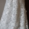 Floor-length sheath wedding dress with boat neckline and train