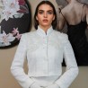 Luxury white tweed jacket with long sleeves and decorative lace details