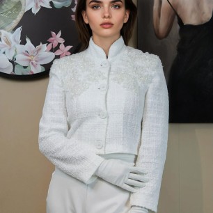 Short white tweed jacket with officer collar, lace, and shiny embellishments