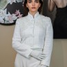 Short white tweed jacket with officer collar, lace, and shiny embellishments