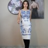 White below-knee linen pencil dress with open back, sleeveless cut, and intricate hand embroidery on premium natural fabric