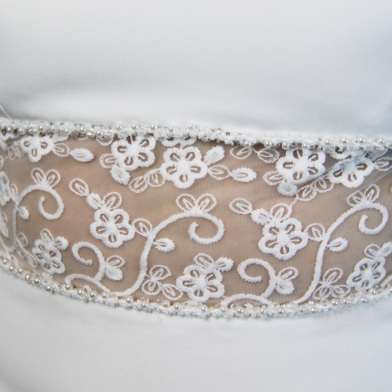 Close-up of hand embellishments on minimalist crepe bridal gown