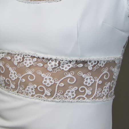 Close-up of hand embellishments on minimalist crepe bridal gown
