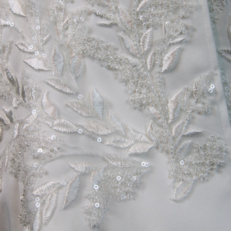 Close-up of couture beadwork on handmade bridal pantsuit