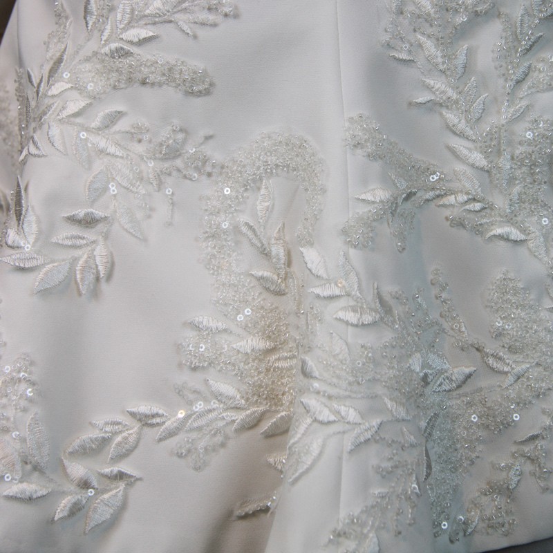Close-up of couture beadwork on handmade bridal pantsuit