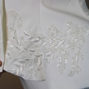 Close-up of couture beadwork on handmade bridal cover-up
