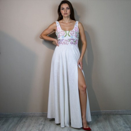 Mode is wearing hand embroidered bridal dress with high front slit