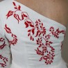 Zoom on the back and hand embroidery on midi wedding dress