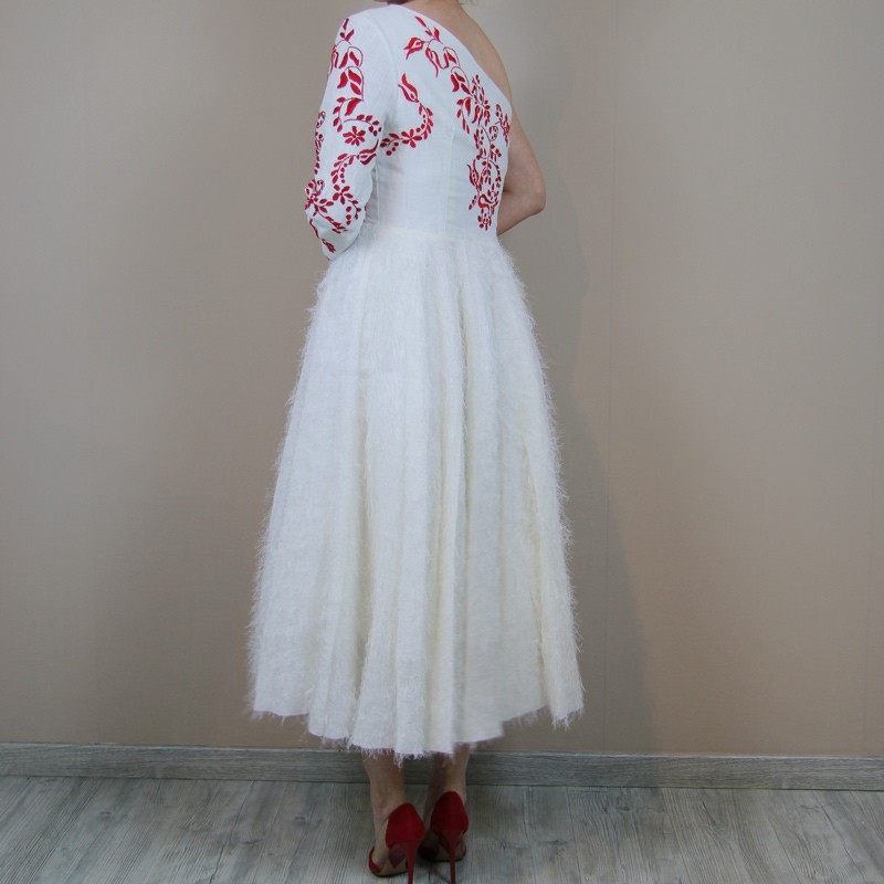 View of the back of midi hand embroidered wedding dress