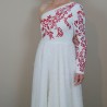 Zoom on the sleeve and hand embroidery on midi wedding dress