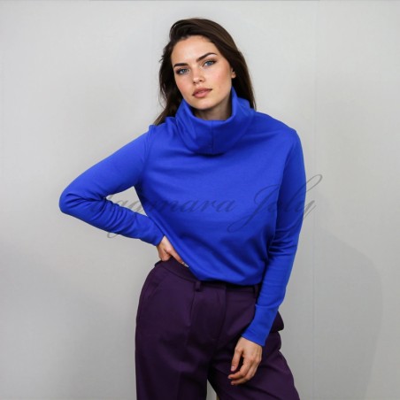 Model is wearing royal blue jersey turtleneck blouse