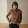 Model is wearing handmade brown jersey turtleneck blouse