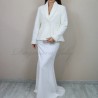 Chic ivory jacket styled as a sophisticated bridal cover-up.