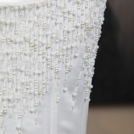 Zoom of the bridal corset showing the hand applied ornaments
