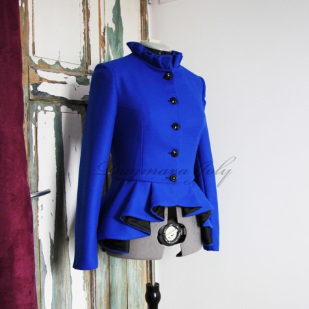 Close-up of pleated collar detail on asymmetrical blue peplum jacket