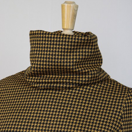 Tailored turtleneck blouse in bold black and mustard houndstooth print, crafted to order