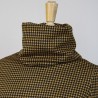 Tailored turtleneck blouse in bold black and mustard houndstooth print, crafted to order