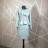 Handmade baby blue skirt suit with peplum blazer on a model