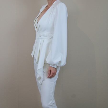 Side view of the sleeve of the white bridal suit