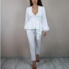 White bridal crepe pantsuit with asymmetrical peplum, made to measure