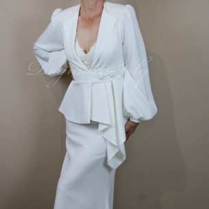 Minimalist white bridal crepe suit with waist belt, pleated peplum blazer, and elegant trailing skirt.