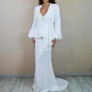 Contemporary bridal suit in luxurious crepe with balloon sleeves and elegant flowing train skirt.