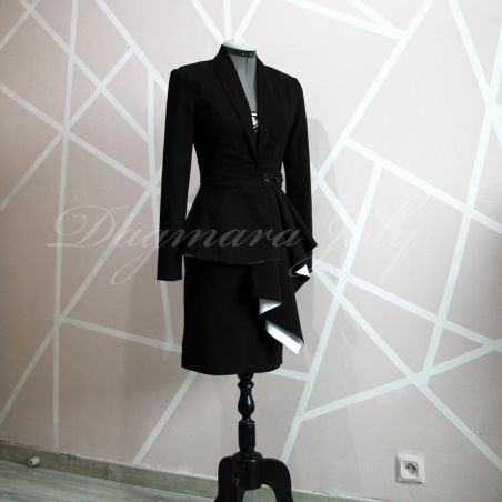 Front detail of asymmetrical closure and shawl collar on a black tailored peplum blazer.