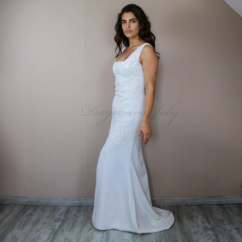 Simple bridal gown with clean lines and elegant silhouette