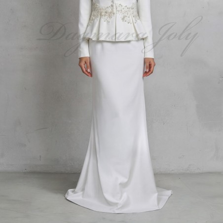 close-up details of hand-embellished pearls, crystals, and sequins on wedding peplum skirt suit