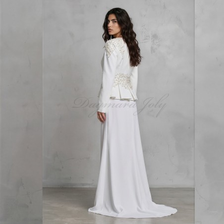 back view of custom wedding peplum skirt suit showcasing intricate beadwork and crystal accents