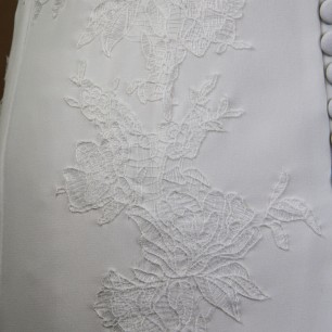 Back lace and button detailing on a handmade French wedding dress
