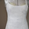 Delicate bridal straps and lace appliqué detail on minimalist wedding gown