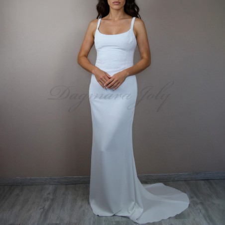 Bridal model wearing a minimalist handmade wedding dress made in France