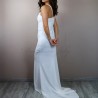 Back view of modern crepe bridal gown with decorative buttons and lace details