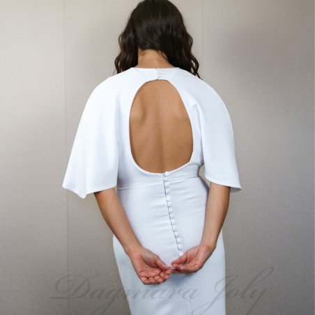 Zoom on the details of the back  of modern crepe bridal gown with decorative buttons and open back