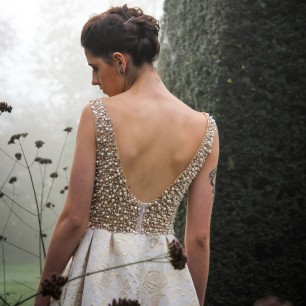 Zoom of luxury jacquard evening gown with U back and hand applied embellishments
