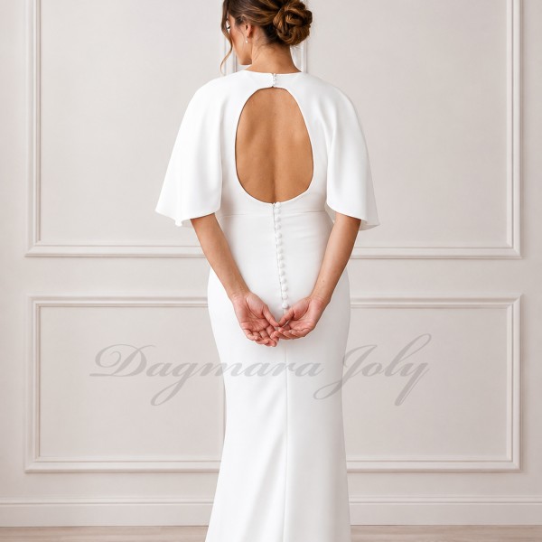 Zoom on the details of the back  of modern crepe bridal gown with decorative buttons and open back