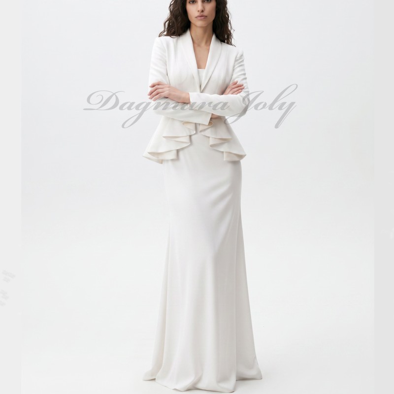 Modern made-to-measure bridal suit in crepe featuring sculptural peplum jacket and floor-length skirt.