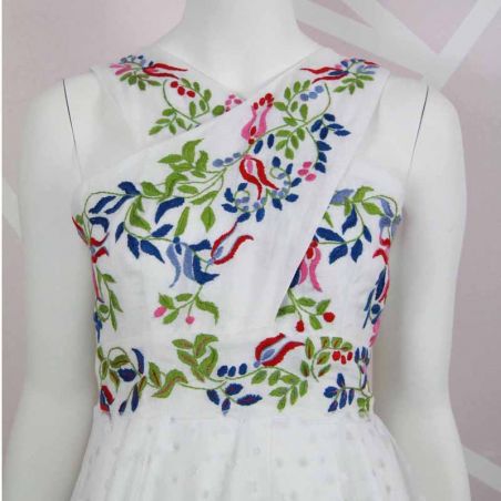 Zoom on hand embroidered floral motif on this wedding sleeveless dress