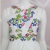 Zoom on hand embroidered floral motif on this wedding sleeveless dress